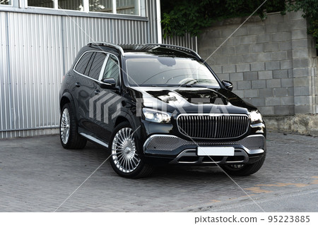 Black new suv luxury car parked at the street 95223885