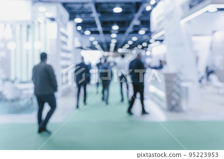 Blurred business people at a expo hall. High quality photo Blurred business people at a expo hall. High quality photo 95223953