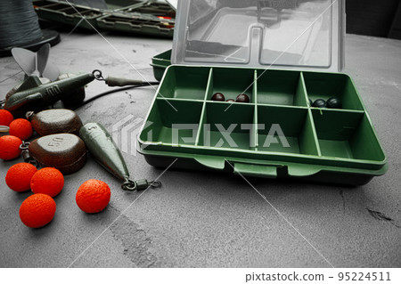 Plastic compartment case and fishing tackle top view Plastic compartment case and fishing tackle top view 95224511