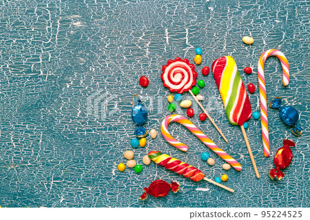Colorful candies on old background 95224525