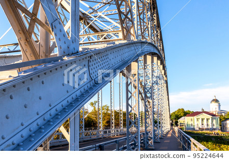 Steel arch bridge across the Msta river in summer Steel arch bridge across the Msta river in summer 95224644