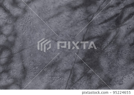 Shadow of leaves on gray concrete wall texture background Shadow of leaves on gray concrete wall texture background 95224655