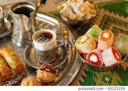 Turkish Coffee served with Turkish Delight on metal tray Turkish Coffee served with Turkish Delight on metal tray 95225109