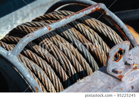 Old rusty steel cable steel wire on spool Old rusty steel cable steel wire on spool 95225245