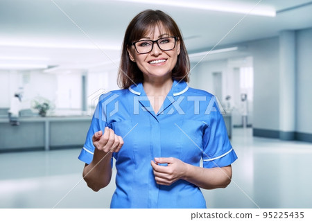 Portrait of a female nurse inside the hospital 95225435
