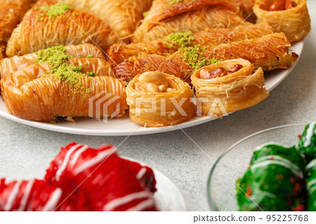Turkish baklava dessert with honey, close up Turkish baklava dessert with honey, close up 95225768