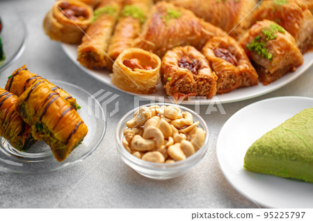 Turkish baklava dessert with honey, close up Turkish baklava dessert with honey, close up 95225797