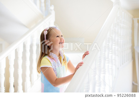 Kids on stairs. Child moving into new home. 95226088