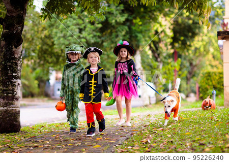 Kids trick or treat. Halloween fun for children. 95226240