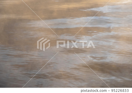 Background material: Steam texture of hot springs floating on the surface of the water in the morning light Background material: Steam texture of hot springs floating on the surface of the water in the morning light 95226833