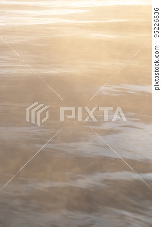 Background material: Steam texture of hot springs floating on the surface of the water in the morning light Background material: Steam texture of hot springs floating on the surface of the water in the morning light 95226836