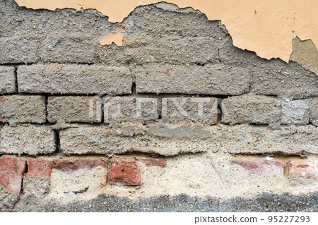 gray brick wall and pieces of plaster closeup background urban gray brick wall and pieces of plaster closeup background urban 95227293
