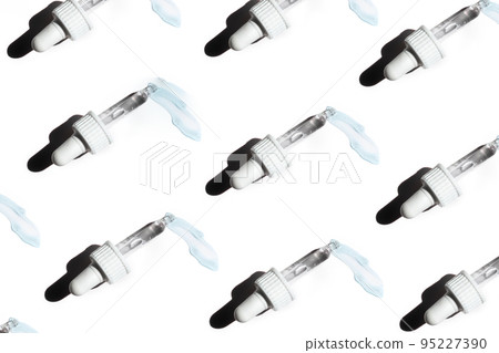 Pattern of face serum in transparent glass pipette. Natural oil, gel, cleaner. Cosmetics and healthcare concept closeup. Dose of retinol. Monkeypox, coronavirus research. Web banner for design Pattern of face serum in transparent glass pipette. Natural oil, gel, cleaner. Cosmetics and healthcare concept closeup. Dose of retinol. Monkeypox, coronavirus research. Web banner for design 95227390