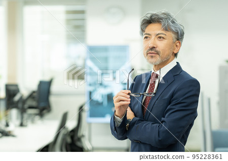 Middle businessman with gray hair Middle businessman with gray hair 95228361