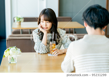 couple saying goodbye in cafe couple saying goodbye in cafe 95231299