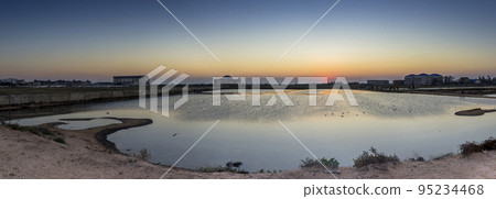 a shallow salt lake near the Azov sea on sunset, Arabat Spit, Ukraine a shallow salt lake near the Azov sea on sunset, Arabat Spit, Ukraine 95234468
