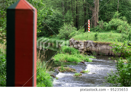 Border poles on the border line between Poland and Belarus Border poles on the border line between Poland and Belarus 95235653