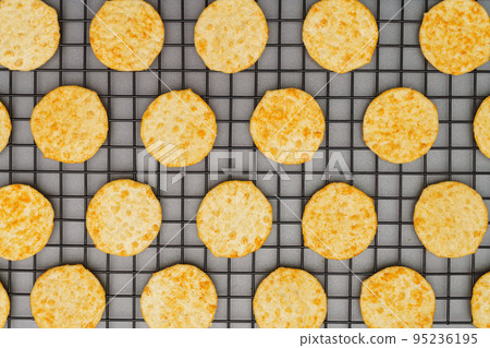 Flat lay of snack, Crispy potato chip arrange on rack oven baked over gray background 95236195