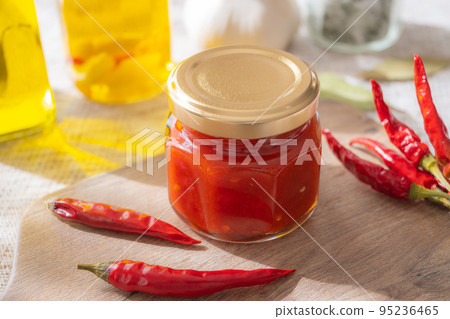 Homemade Pepper Sauce Bottled Red Peppers Pickled in Oil 95236465