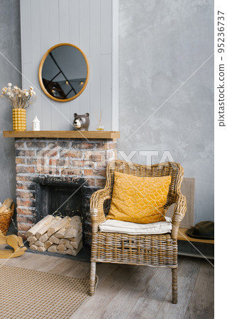 Grey living room and yellow room with fireplace and wooden decor. The style of the living room is Scandinavian. Grey living room and yellow room with fireplace and wooden decor. The style of the living room is Scandinavian. 95236737