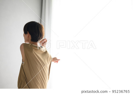 A woman stretching in her room faceless A woman stretching in her room faceless 95236765
