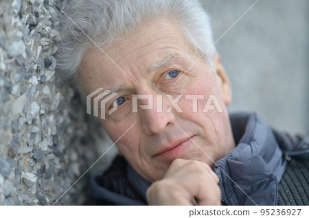 Portrait of a beautiful elderly pensive man Portrait of a beautiful elderly pensive man 95236927
