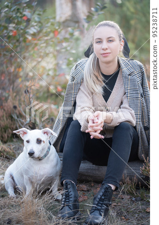 Young attractive woman playing with dog 95238711