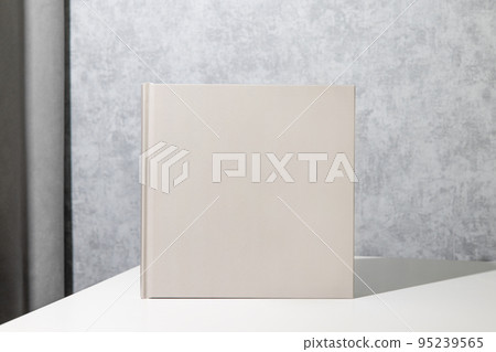 Grey book mock up, great design for any purposes. Technology concept. Business concept in grey room interior Grey book mock up, great design for any purposes. Technology concept. Business concept in grey room interior 95239565