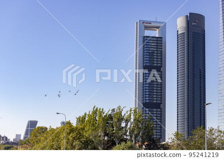 Helicopter. Airplane. Military vehicle. Spanish Air Force on the day of the National Holiday of October 12 flying over the streets of the city of Madrid. MADRID, SPAIN - OCTOBER 12, 2022. 95241219