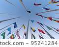 Doha, Qatar - October 9, 2022: The Flag Plaza, displays 119 flags from countries with authorized diplomatic missions, including flags of the European Union, the United Nation and the GCC. 95241284