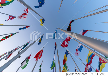 Doha, Qatar - October 9, 2022: The Flag Plaza, displays 119 flags from countries with authorized diplomatic missions, including flags of the European Union, the United Nation and the GCC. Doha, Qatar - October 9, 2022: The Flag Plaza, displays 119 flags from countries with authorized diplomatic missions, including flags of the European Union, the United Nation and the GCC. 95241285