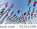 Doha, Qatar - October 9, 2022: The Flag Plaza, displays 119 flags from countries with authorized diplomatic missions, including flags of the European Union, the United Nation and the GCC. 95241286