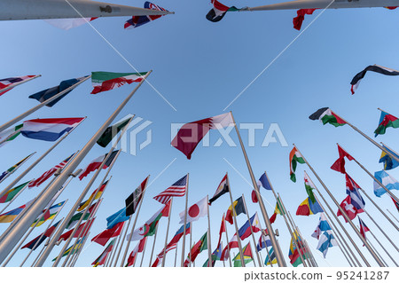 Doha, Qatar - October 9, 2022: The Flag Plaza, displays 119 flags from countries with authorized diplomatic missions, including flags of the European Union, the United Nation and the GCC. Doha, Qatar - October 9, 2022: The Flag Plaza, displays 119 flags from countries with authorized diplomatic missions, including flags of the European Union, the United Nation and the GCC. 95241287