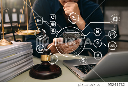 justice and law concept.Male judge in a courtroom  the gavel, working with smart phone and laptop and digital tablet computer with VR icon justice and law concept.Male judge in a courtroom  the gavel, working with smart phone and laptop and digital tablet computer with VR icon 95241782