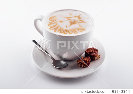 Cappuccino mug close up with chocolate chips 95243544
