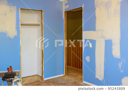 Cracks in walls ceilings drywall that need to be repaired with use spatula to put gypsum into plasterboard that has been damaged Cracks in walls ceilings drywall that need to be repaired with use spatula to put gypsum into plasterboard that has been damaged 95243809