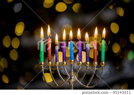 An Jewish holiday Hanukkah symbolized by Hanukkiah Menorah burned candles on blurred background An Jewish holiday Hanukkah symbolized by Hanukkiah Menorah burned candles on blurred background 95243811