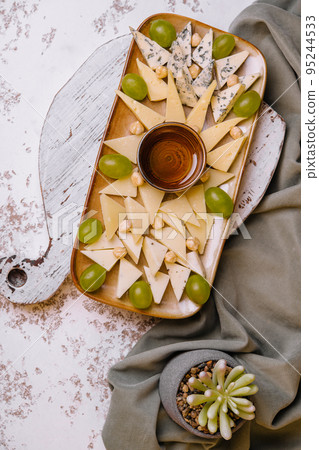 Cheese plate. delicious cheese mix on plate 95244533