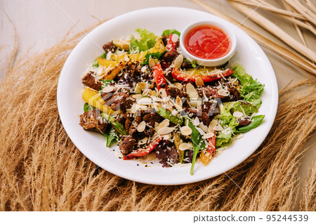 Close up of warm salad with beef and vegetables 95244539