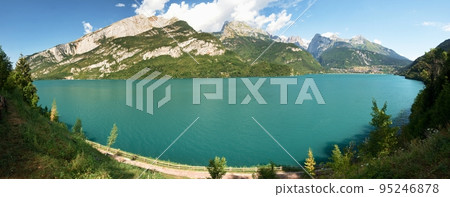 The town and lake with the same name Molveno lake nestled in the Dolomites The town and lake with the same name Molveno lake nestled in the Dolomites 95246878