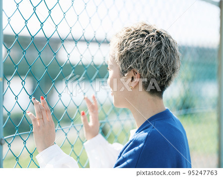 fence and woman fence and woman 95247763
