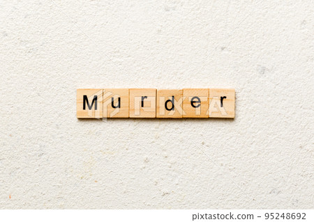 murder word written on wood block. murder text on table, concept murder word written on wood block. murder text on table, concept 95248692