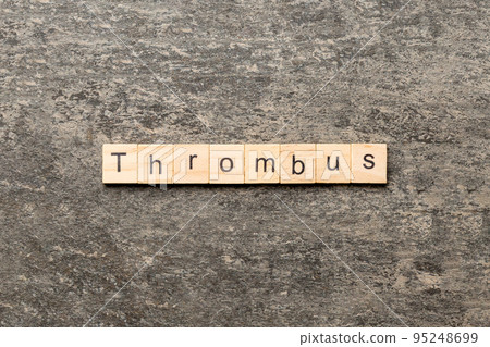 thrombus word written on wood block. thrombus text on table, concept 95248699