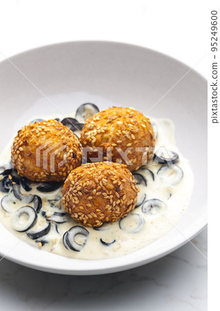 chickpeas balls with creamy black olives sauce chickpeas balls with creamy black olives sauce 95249600