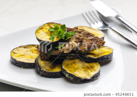 meat in breadcrumbs with grilled aubergine meat in breadcrumbs with grilled aubergine 95249651