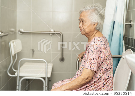 Asian senior or elderly old lady woman patient use toilet bathroom handle security in nursing hospital ward, healthy strong medical concept. 95250514