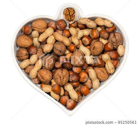Heart Shaped Bowl with Dried Fruit Mix Isolated on White Background 95250561