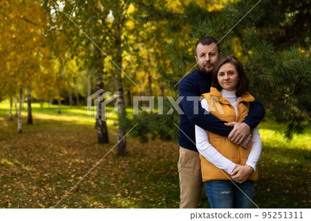 happy classic traditional family hugging against autumn forest background happy classic traditional family hugging against autumn forest background 95251311