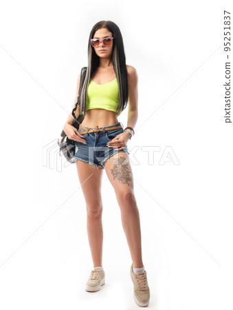 sexy brunette in summer clothes on a white background 95251837