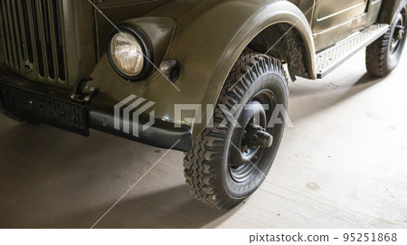 Part of the old soviet army car jeep. Restored retro car. Close-up 95251868